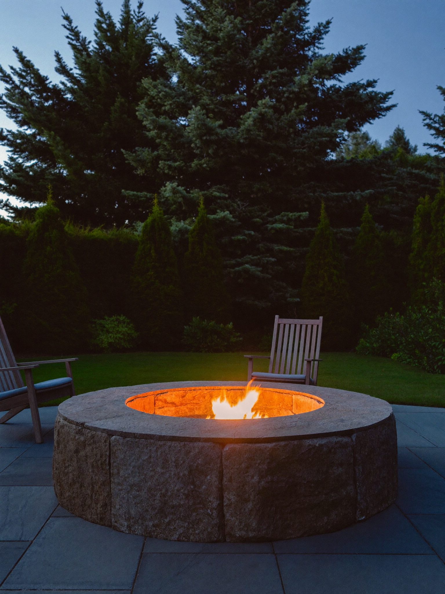 Stone firepit and seating at dusk