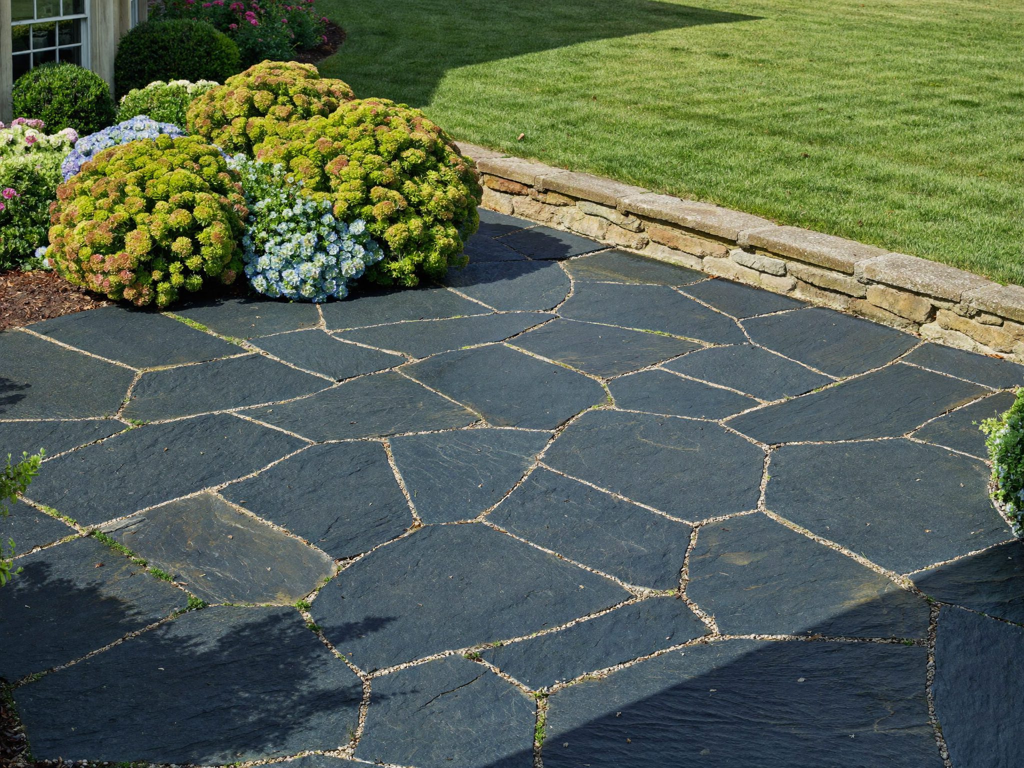 Bluestone terrace with garden beds